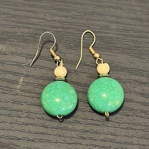 Turquoise stone and white bead dangle earrings.
